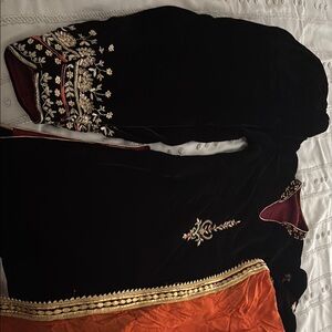 Indian outfit set includes dupatta , kameez and salwar. It was hand embroidered